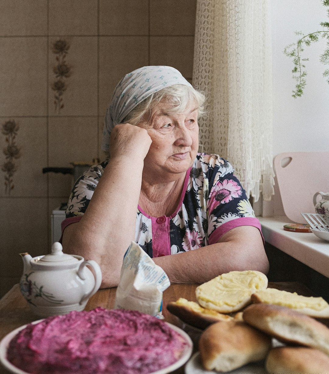 elderly woman baking bread