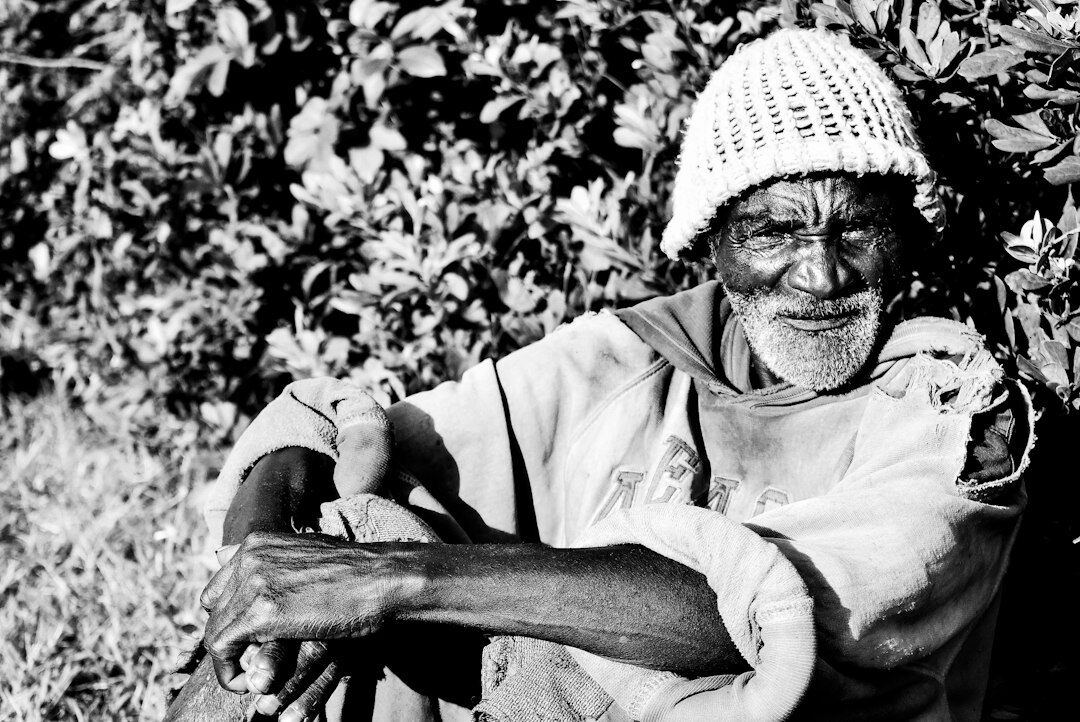 elderly woman knitting outdoors